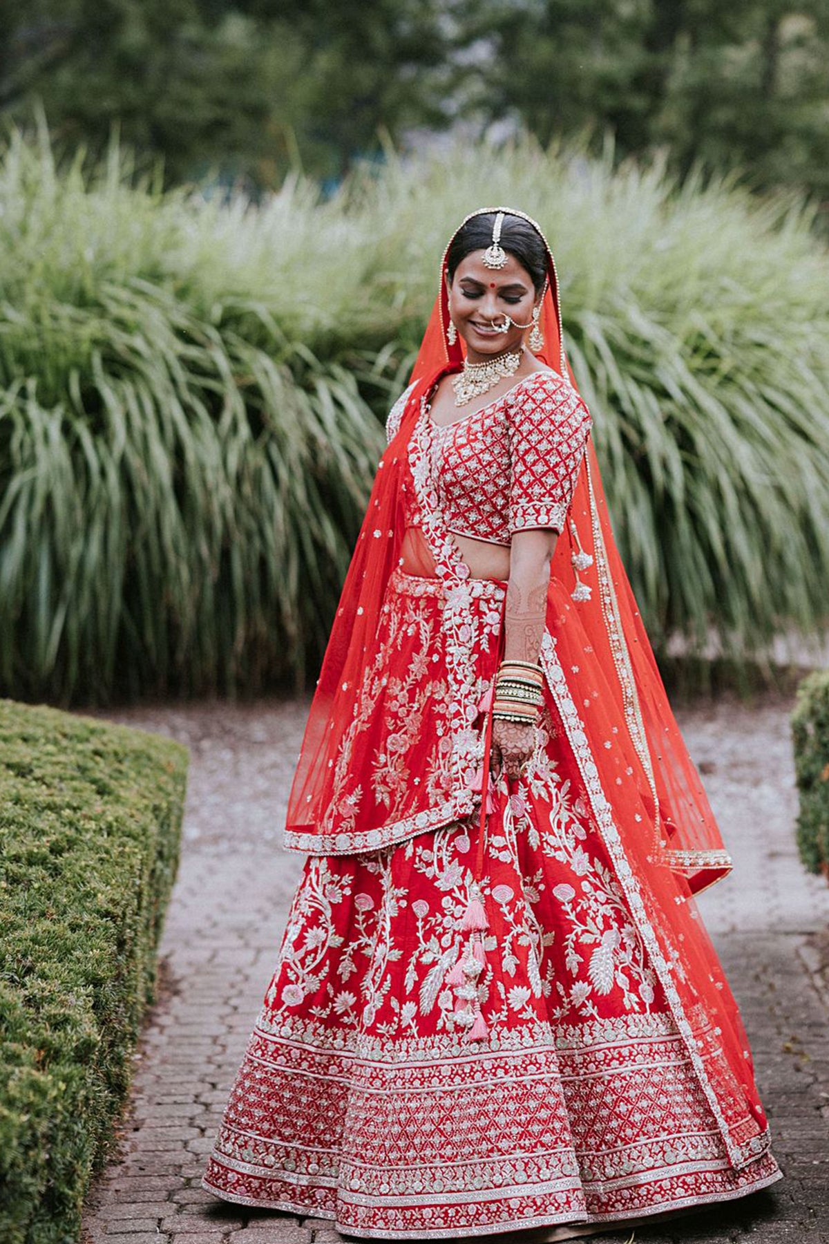 Chamee and Palak red lehenga bride